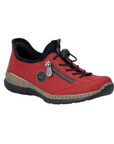 Red slip-on shoe with bungee laces, faux side zipper, Rieker logo in circle side emblem, brown faux cork midsole and a black outsole.
