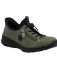Green slip-on shoe with bungee laces, faux side zipper, Rieker logo in circle side emblem, brown faux cork midsole and a black outsole.