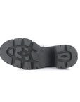 Lugged outsole of heeled Chelsea boot.