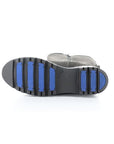 Aggressive treaded outsole of winter boot with blue fiber glass plug lines.
