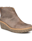 A brown suede wedge bootie with a zipper on the side, elastic cut out on front and tan midsole accent.