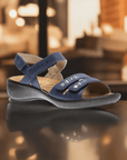 Stylish Josef Seibel Ibiza 86 sandal in navy blue displayed in a warm indoor setting, featuring premium leather and a cushioned footbed.