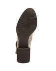 Brown light wave treaded outsole of ankle boot.