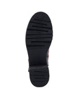 Black rubber outsole of combat boot with light tread.