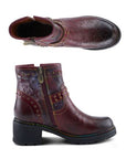 Pair of A burgundy ankle boot with hand-painted floral details, a stud inlay, inside zipper and a rubber platform outsole.