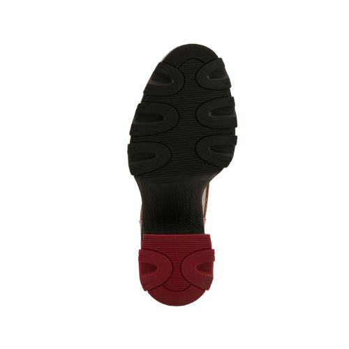 Black Rubber chunky outsole of heeled shoe with red heel accent rubber.