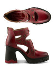 Pair of Red leather sculpted chunky block heel shoes with hand-painted floral pattern, cut out accents, 3d floral charms and a zipper at heel.