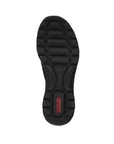 Outsole of black Women's Rieker L32F1 Slip-On Sneaker featuring anti-slip tread and shock-absorbing design for all-day support.