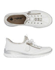 Top and side views of white Women's Rieker L32F1 Slip-On Sneaker highlighting breathable material, elastic laces, and cushioned footbed.
