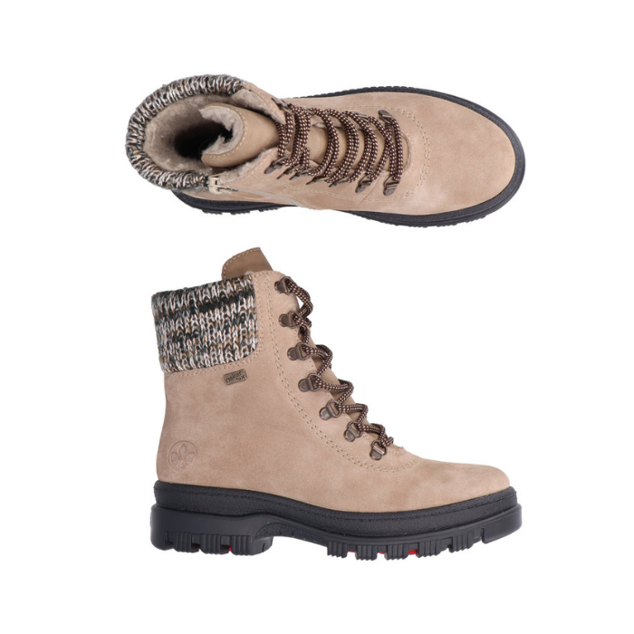 Pair of Beige lace up mid boots with grey knit collar, rugged black outsole, and retractable ice cleats.