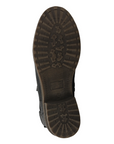 Brown treaded outsole with low heel of a Chelsea boot.