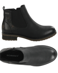 Pair of Chelsea Boot in black with elastic side panels, side zipper, textured accent heel and low heel.