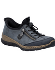 Blue slip-on shoe with bungee laces, faux side zipper, Rieker logo in circle side emblem, brown faux cork midsole and a black outsole.