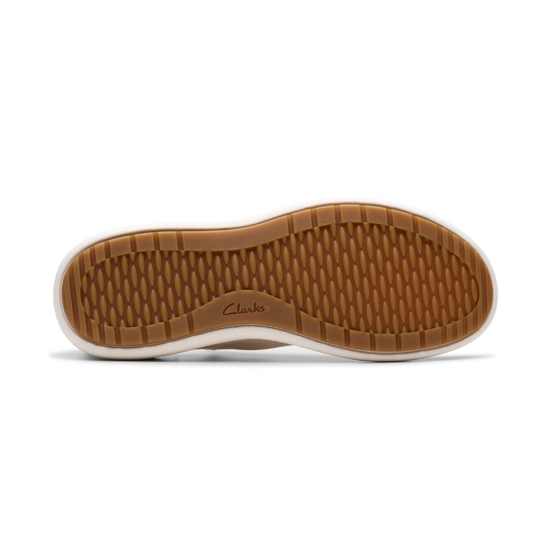 Outsole view of Clarks Nalle Step Knit Sneaker in white. Durable rubber sole with textured grip for enhanced traction and everyday stability.