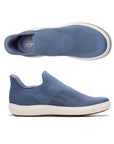 Top and side views of blue Clarks Nalle Step Knit Sneaker for women. Breathable knit fabric and step-in design for effortless wear and support.