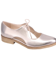 Soft gold leather oxford with d’Orsay side cutouts and low stacked heel.