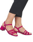 Model wearing Women's Remonte D1L52 Sling-Back Heel showcasing adjustable ankle strap and cushioned sole for all-day comfort.