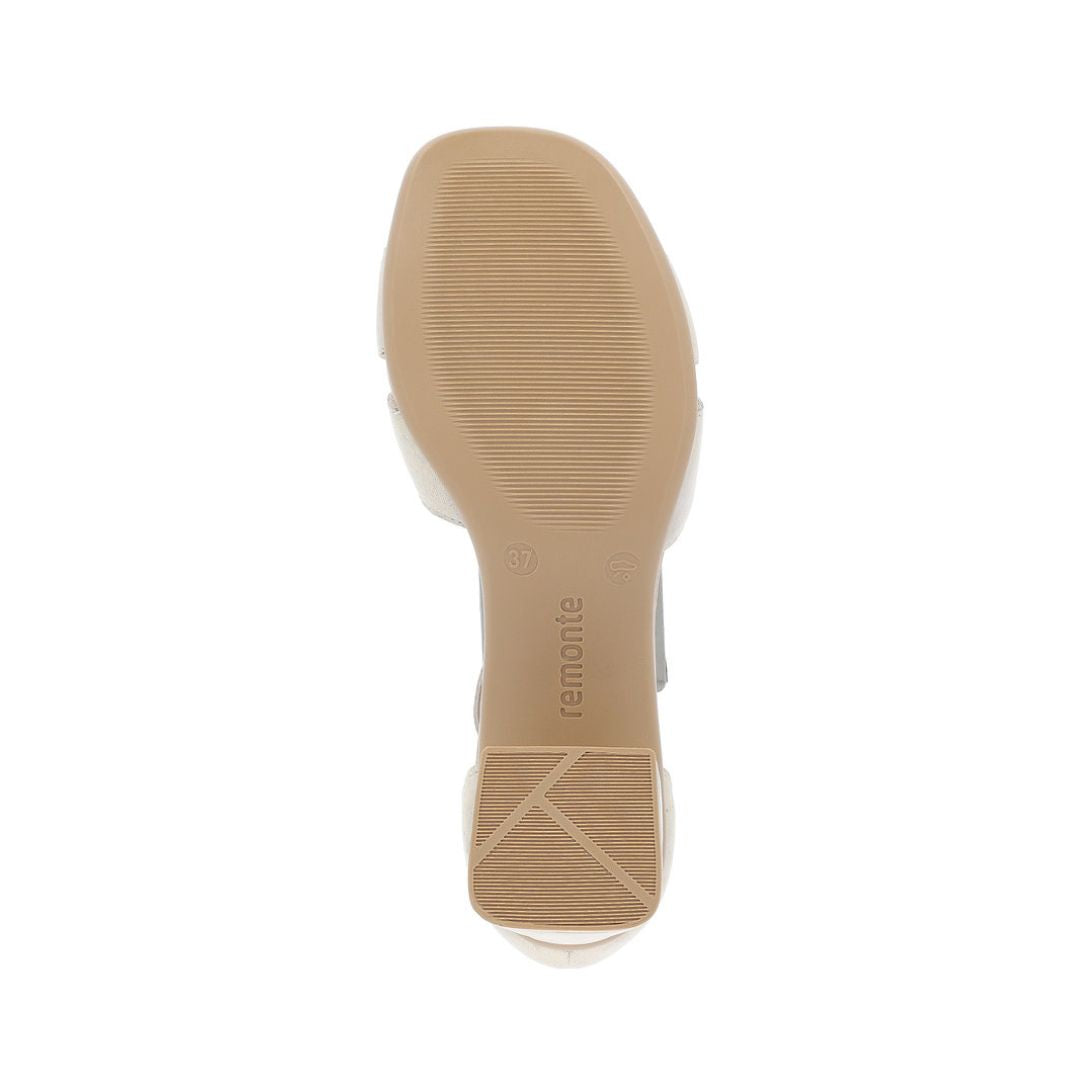 Outsole view of the beige Remonte D1K50 sling-back sandal highlighting the textured rubber sole and block heel for added grip and comfort.
