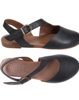 Pair of Black slingback D'orsay sandals with buckle closure, asymmetrical straps and tan Bueno logo'd footbed.