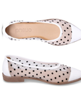 Pair of white with black Polka dot flat shoe with white cap toe and heel, tan Bueno logo'd footbed, mesh upper and beige outsole.