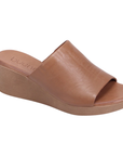 Brown slide sandal with brown wedge outsole and tan Bueno logo'd footbed.