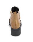 Heel of Yellow ankle boot with dual side zippers, pull tab and black lugged outsole