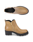 Pair of Yellow ankle boots with side zipper, pull tab and black lugged outsole.