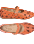 Pair of Mary Jane Flat in orange leather with floral laser-cut design, Velcro strap, tan Bueno footbed and tan outsole.