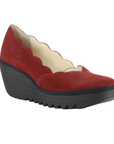 A single red suede wedge shoe with a scalloped edge and a chunky black platform outsole.