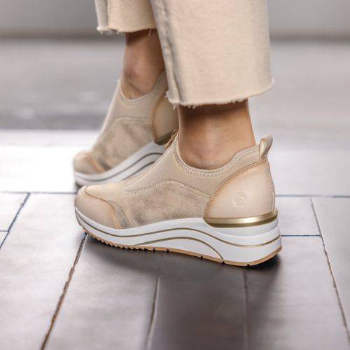 Rear view of the Remonte D0T08 slip-on sneaker on foot, showcasing the cushioned wedge heel and sleek design.