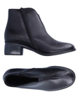 Pair of Black ankle boots with low heel, small slit of gorring on vamp, inside zipper and stitch detail through middle of toe.