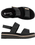Pair of Backstrap Sandals in black with gold accents, two Velcro straps, black Remonte logo'd footbed, faux jute and black platform midsole and lugged black outsole.