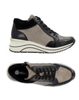 Top and profile view of Gold Lace-up wedge sneakers have black laces, gold and black portions on the uppers. The foot bed is black with silver Remonte logo at heel The wedge midsole is white with black wave lines and the outsole is black