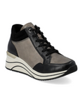Gold Lace-up wedge sneakers have black laces, gold and black portions on the uppers. The wedge midsole is white with black wave lines and the outsole is black
