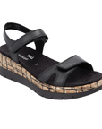A black backstrap platform wedge sandal with a cork-textured midsole, black Remonte logo'd footbed and black outsole.