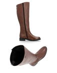 Pair of brown knee-high boots with inside zipper and black outsole.