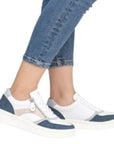 Model wearing navy Women's Remonte D0J01 sneakers with jeans, showcasing their versatile style and everyday comfort.