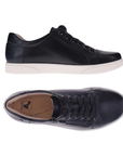 Pair of Black leather sneakers with laces, side zipper, tan Revere logo'd footbed and white outsole.