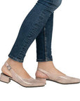 Model wearing Rieker 47066 women's sling-back heeled leather sandals with jeans, showcasing casual elegance and comfort fit.