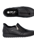Pair on black slip-on shoes with a zipper and accent patent across toe with detail stitching.