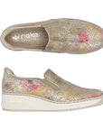 Top and side views of Women's Rieker 48761 Slip-On Shoe showing floral pattern and cushioned wedge sole for casual summer wear.