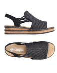 Pair of Black woven sandals with faux cork midesole, thin elastic side straps, backstrap and tan Rieker logo'd footbed