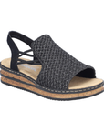 Black woven sandal with faux cork midesole, thin elastic side straps, backstrap and tan Rieker logo'd footbed.
