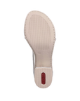 Beige light treaded outsole with red Rieker logo on block heel.