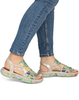 Green Floral sandals worn with blue jeans.