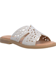 Beige slide sandal with perforations through rhinestone covered straps, tan Remonte logo'd footbed and tan flat outsole.