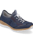Navy blue slip on sneaker with rainbow side accent rainbow stitching, white bungie closure and faux cork midsole and white outsole.