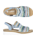 Pair of Wedge backstrap sandals in blue with green, beige and gold woven into the upper, elastic sides, tan Rieker logo'd footbed and white outsole.