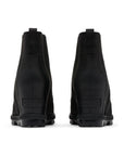 Heels of black wedge Chelsea boot with Sorel logo stamped at base.