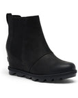 Black leather slip on wedge Chelsea boot with lugged outsole.